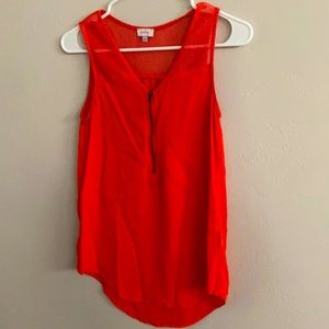 Orange muscle tank, zipper and mesh detail. Small